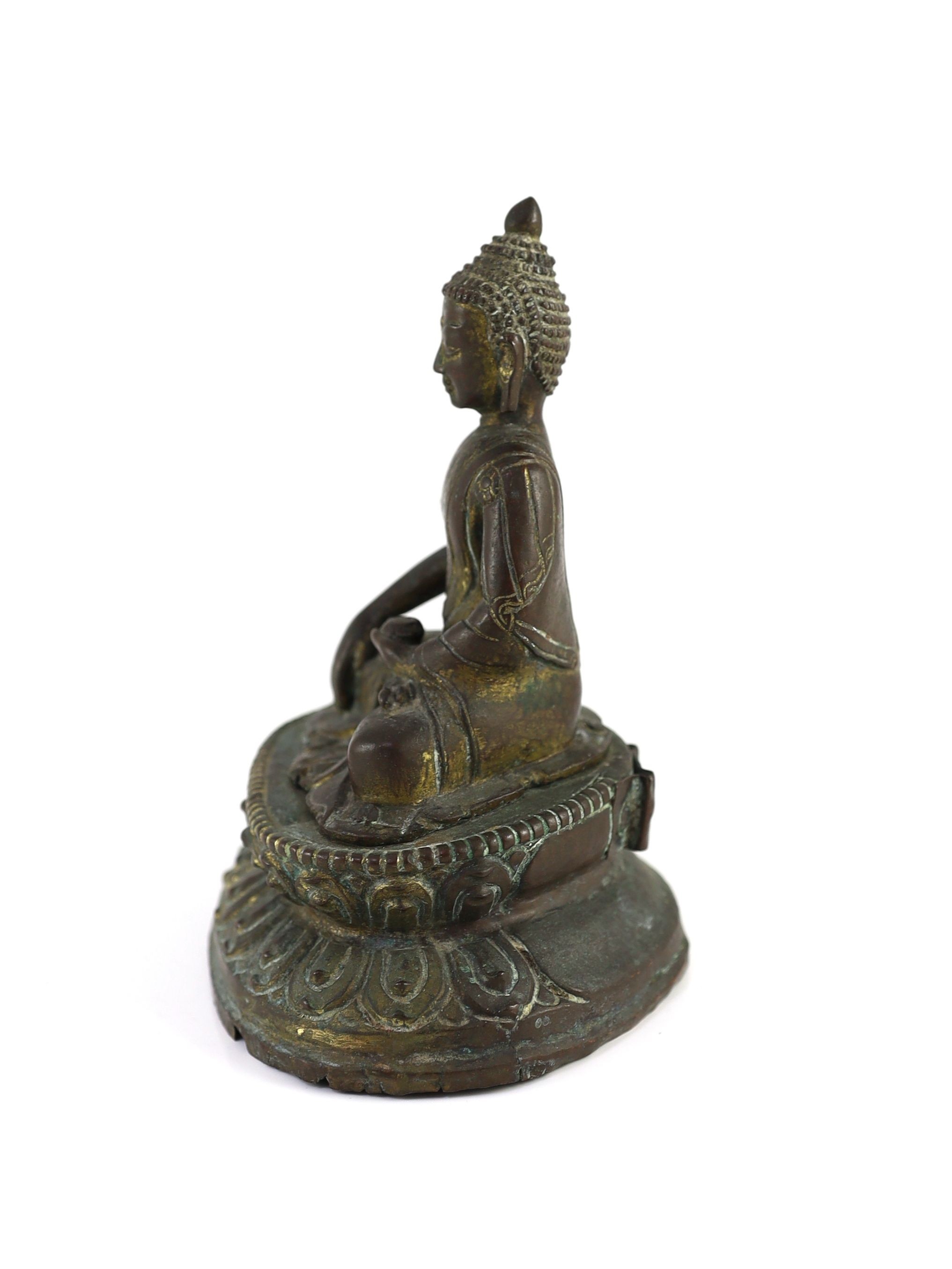 A Nepalese or Tibetan gilt copper alloy figure of Buddha Shakyamuni, 18th/19th century, 15cm high